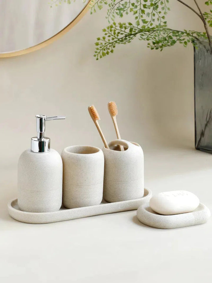 Modern Minimalist 5-Piece Beige Resin Bathroom Accessories Set with Lotion Dispenser, Toothbrush Holder, and Soap Dish 1